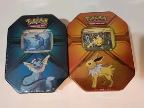 210-10285 Pok Mon Triple Effect Tins Vaporeon And Jolteon. 2017. Factory Sealed