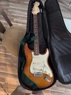 Fender American Performer Stratocaster Electric Guitar - Honey Burst With Case Open. Price: $1100.00.