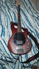 Sterling By Music Man Stingray RAY4 Bass Guitar Walnut Stain Black Pickguard Open. Price: $310.00.
