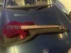 Mitchell MB200 Electric Bass Blood Red W/ Case Excellent Condition (used). Price: $170.00.