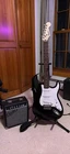 Fender Squier Electric Guitar Black Right-handed W/ Amplifier & Strap Used. Price: $200.00.