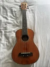 Ukelele Oscar Schmidt By Washburn OU5E Gloss & Abalone With Violin Case Used. Price: $200.00.