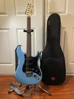 Squier Stratocaster Electric Guitar Blue W/ Gig Bag, Strap, Cables & Stand Used. Price: $229.00.