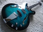 Chowny CHB-1 Semi-hollow Short Scale Emerald Burst Bass Guitar (first Edition). Used. Price: $749.99.