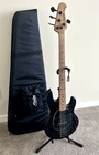 Sterling Music Man STINGRAY34 - Black/white Grain Ash Body Roasted Maple Neck Used. Price: $699.00.