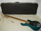 Ernie Ball Usa Music Man Stingray 5H Teal String Electric Bass W Hard Case Used. Price: $1599.00.
