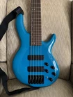 Cort C5DELUXECBL Artisan Series Bass Guitar (5 String). Candy Blue Open. Price: $350.00.