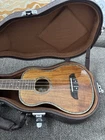 Oscar Schmidt OU5E Concert Ukulele, Koa Mahogany With Abalone Inlay Used. Price: $199.00.