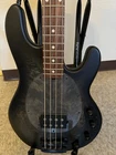 Sterling By Music Man STINGRAY34 Burl Electric Bass With Gig Bag Open. Price: $650.00.