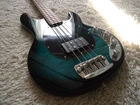Sterling By Music Man Stingray RAY34 Teal Green Flame Top Bass Guitar. Used. Price: $749.99.
