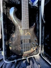 Dean Rhapsody 12-STRING Bass Guitar Transparent Black Gloss Wood Used. Price: $799.00.