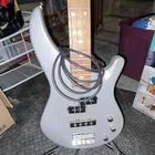 Mitchell MB100CS Electric Bass Guitar Silver 4 String W/ Stand & Cable Used. Price: $115.00.