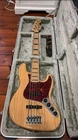 Fender Jazz Bass American Deluxe Natural Ash Body 5-STRING Guitar W/ Case Used. Price: $2000.00.