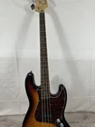 Squier Jazz Bass - Electric W/hard Case Used. Price: $399.99.