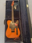 Squier By Fender Electric Guitar - Orange, Solid Body, 6 String, Hard Case New. Price: $400.00.