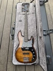 Fender Limited-edition American Ultra Precision Bass Guitar Tiger's Eye Open. Price: $3500.00.
