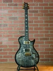 Prs Tremonti Signature 10-TOP Electric Guitar With Tremelo Charcoal Contour New. Price: $5540.00.