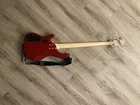 Red Donner Electric Bass Guitar, Comes With Bag And Cable. Used. Price: $175.00.