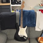 Black Fender Squier Strat Solid Wood Body 6-STRING Electric Guitar Right-hand Used. Price: $90.00.
